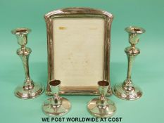 A pair of hallmarked silver candlesticks, height 17.