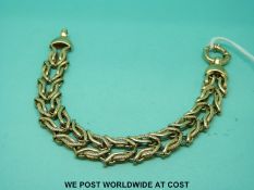 A 9ct gold bracelet made up of a double row of interwoven links (26.