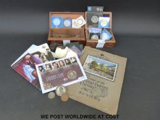 An amateur collection of coins including mint £5 coin, other redeemable currency, crowns,