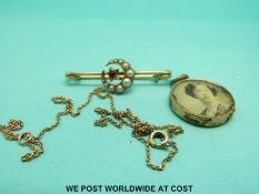 A 9ct gold chain and a 15ct gold brooch set with seed pearls and a ruby etc