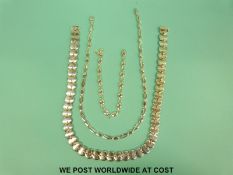 Two silver necklaces and a silver bracelet