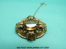 A Victorian yellow metal brooch set with a citrine