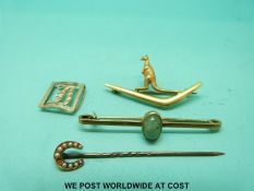A 15ct gold brooch in the form of a kangaroo and boomerang, a 9ct gold brooch,