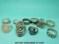 Ten silver rings including buckle rings