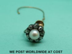 A Victorian earring set with a pearl and diamonds
