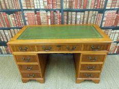 A leather inset twin pedestal desk (H76xW122xD61cm)
