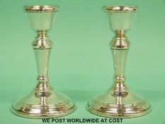A pair of hallmarked silver candle sticks by Broadway & Co, B'ham 1996, height 10.