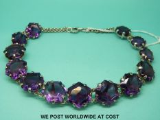 A early 20thC silver necklace set with 13 large hexagonal cut amethysts with hand crafted setting