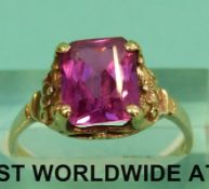 A 10k ring set with a pink topaz