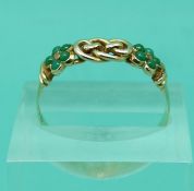 A 15ct gold keeper ring (size L) and a yellow metal ring marked 15ct set with turquoise (size T)