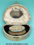 A cased Art Deco hallmarked silver-mounted comb and brush set,
