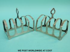 A pair of George V hallmarked silver four slice toast racks, Birmingham 1934 maker Fenton,