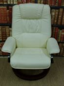 A contemporary leather chair and footstool