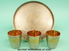A set of three Russian white metal shot glasses on tray, with matt finish,