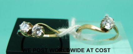 Two 9ct gold rings set with cubic zirconia in a twist setting (size M)
