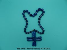 A 19thC Russian cross on a sodalite/azurite beaded necklace.