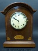 A mahogany cased mantel clock by Gilbert, made in Winsted Conn, USA,