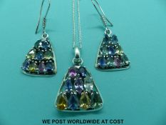 A silver pendant set with multi-coloured sapphires including pink oval cut,
