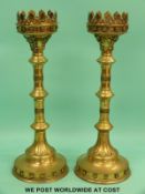 A pair of large brass candlesticks,