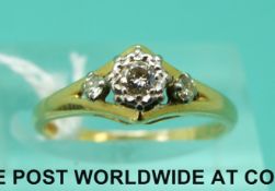 An 18ct gold ring set with three diamonds (size M)