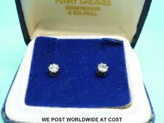 A pair of 18ct gold earrings set with diamonds of approximately 0.