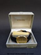 Roamer 18ct gold gentleman's wristwatch with date aperture and gold face, on black leather strap,