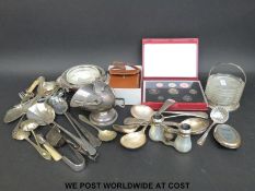 A quantity of silver plated cutlery, binoculars,