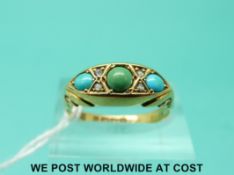 An 18ct gold ring set with turquoise and diamonds (size R)