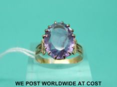 A Victorian yellow metal ring set with a large amethyst (size R)