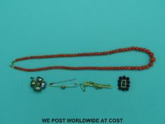 Two 9ct gold bar brooches, a Victorian mourning brooch,