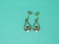 A pair of 9ct gold earrings set with pearls and rubies