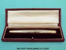 A 9ct gold Parker fountain pen uninked in original case and box marked Presidential Single