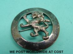 A hallmarked silver Scottish kilt pin in the form of a lion marked Scott Adie Regent Street,