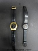 Two Swatch watches, one with date aperture.