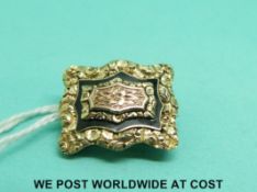 A George IV yellow metal brooch with layered foliate decoration verso engraved 