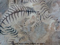 A large Japanese Meiji period tapestry depicting tigers with bronze ground,