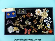 A quantity of brooches to include a Weiss crystal brooch in the form of a butterfly,
