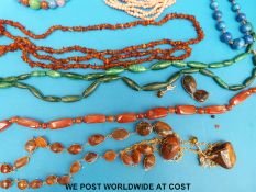 A collection of necklaces to include six strand coral necklace, lapis lazuli,