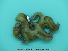 A carved jadeite pendant.