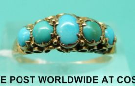 A Victorian ring set with five turquoise cabochons (size P)