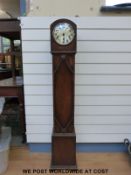 A c1930's eight day oak cased Granddaughter clock with Westminster chimes,