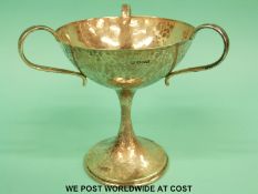 An Edward VII hallmarked silver Arts & Crafts three-handled bon bon dish of hammered design,