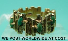 A 9ct gold ring set with turquoise in a textured setting (size G)