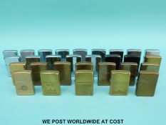 Twenty nine Zippo lighters, some branded to include B&H, Marlboro,