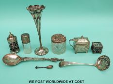 A collection of hallmarked silver items to include glass linered cruets,