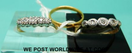 Two 18ct gold rings set with diamonds in a platinum setting and a 22ct gold wedding band (5.