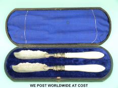 A cased pair of Victorian hallmarked silver and mother of pearl handled butter knives