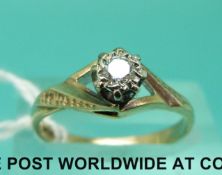 A 9ct gold ring set with a round cut diamond (size N)