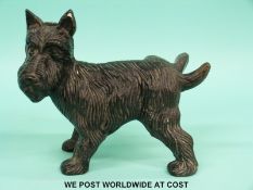 A cast iron doorstop formed as a dog lifting its leg (length 19cm)