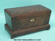 A 19thC mahogany sarcophagus shaped tea caddy with ivory inlay,